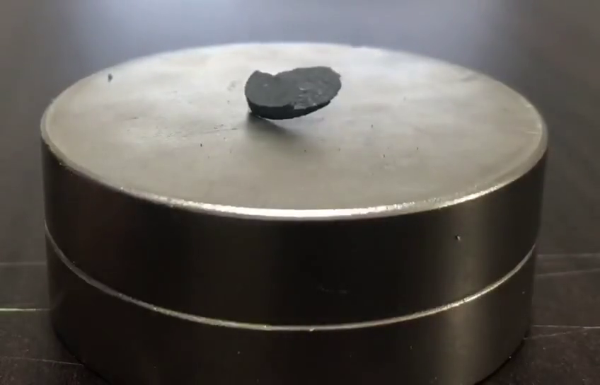 Pellet of LK-99 being repelled by a magnet