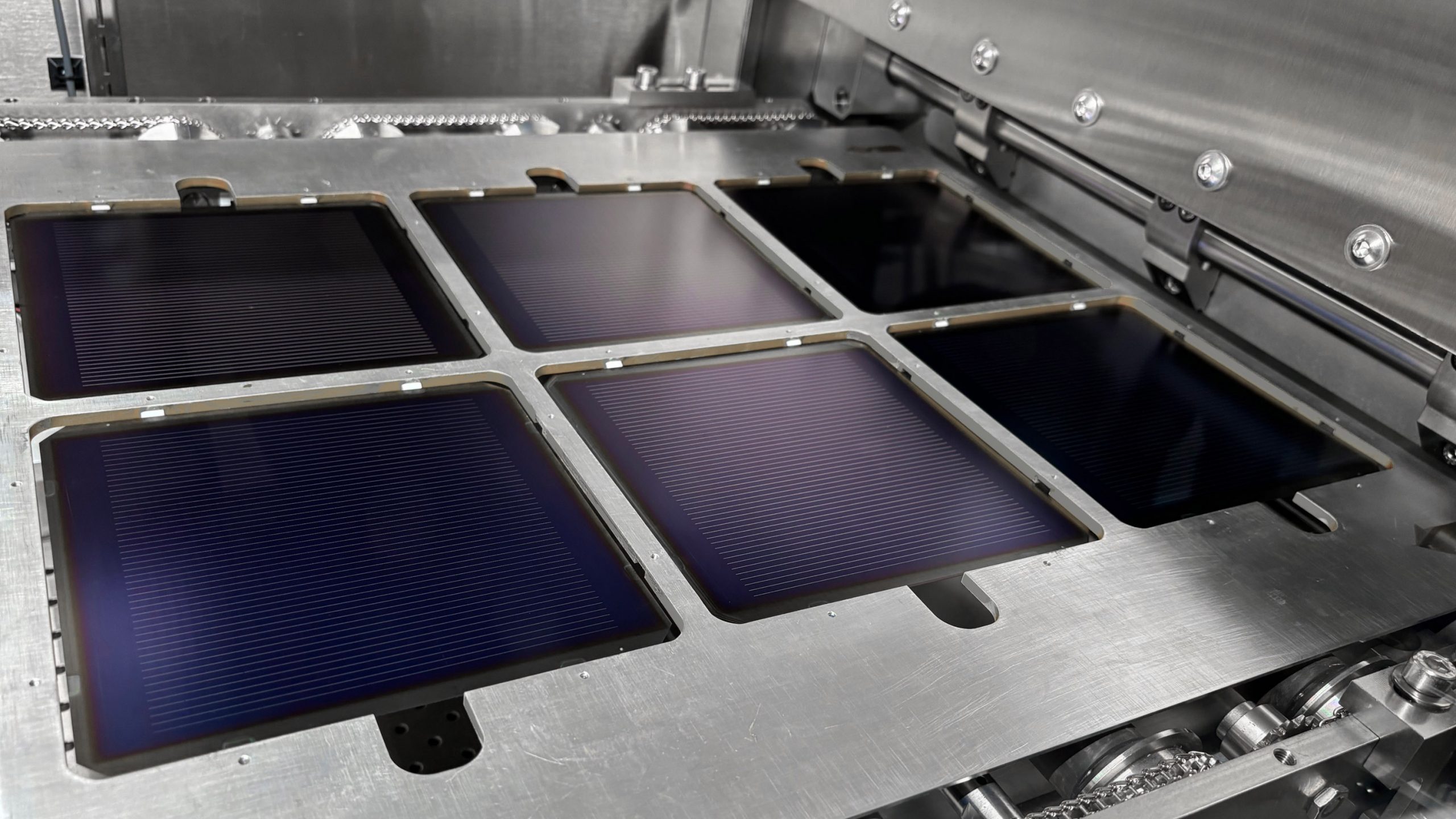 6 full-size perovskite tandem cells in a metal assembly carriage